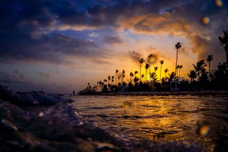 Carribean vacation, beautiful sunset over tropical beach in Punta Cana. Landscape of paradise...