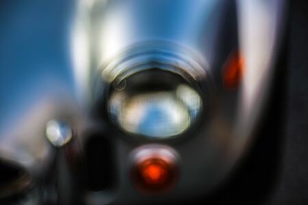 Retro headlight lamp vintage classic car. Soft focus, boke background with copy space. Close-up view...