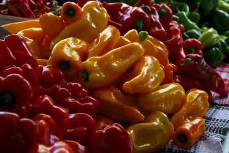Biologic, natural cultivated sweet pepper on a market counter. Vegetables from the farmers market. Ecologic products. Natural background.の写真素材