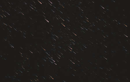 tracks of stars in the night sky.Abstract background