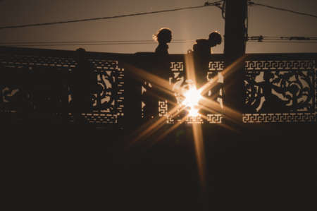 People cross the bridge at sunset.Saint Petersburg, Russia