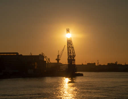 Ship repair plant at sunset. Seascape. Shipbuilding in Russia.の写真素材
