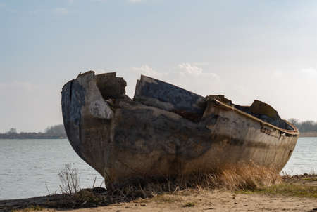 Old fishing boat on the beachの写真素材