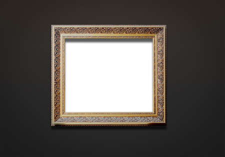 Old museum golden frame on a dark background. copyspace.