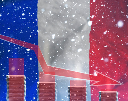 Energy crisis in France..stacks of coins in front of the flag of France with snow symbolizing crisis in economy of the country.の写真素材