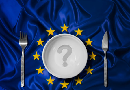 An empty plate with a question mark on the background of the European Union flag. Global crisis, food supply problem. Conceptual message, starvation and famine issue. Hunger diet conceptの写真素材