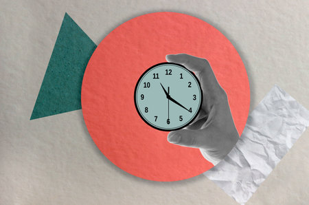 Hands hold a clock. contemporary art collage. copyspace.の写真素材