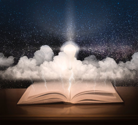 Open book with space and stormy sky. The included light bulb against the background of the starry sky and the book.の写真素材