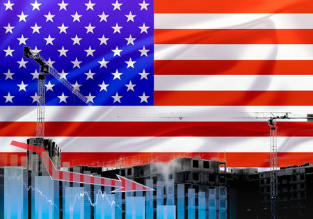 Construction cranes on the background of the US flag. The concept of the crisis in America.の写真素材