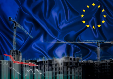 Construction cranes on the background of the EU flag. The concept of a crisis in construction.の写真素材