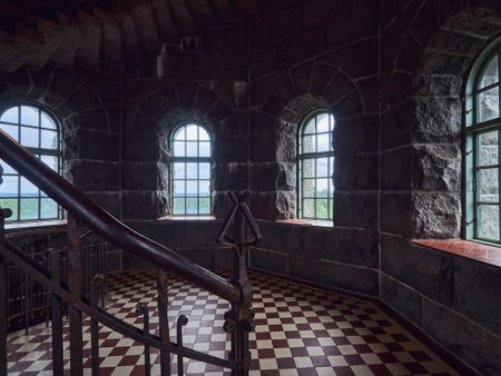 Finland, Hameenlinna - June 15, 2019, in the Aulanko tower near Hameenlinna, an old metal staircase is in the foreground.のeditorial素材