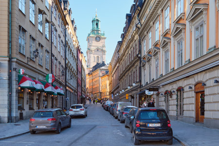 Sweden, Stockholm - 24 February 2017. Narrow small streets and courtyards of old part of Swedish Stockholm: sunny February tourist day in capital of Scandinavia, Gamla Stan island.のeditorial素材