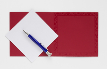 Mockup of Greeting Card or Invitation, with Blank Paper and Pen âÃÃ¬ Top View, Isolated.の写真素材
