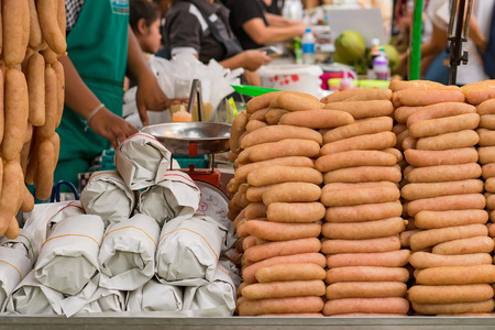 Asian street food market, homemade sausages and meatの写真素材