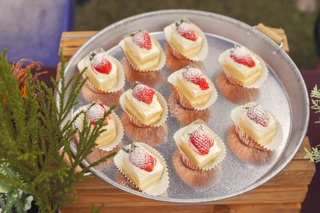 The sweet dessert with strawberry serve on the tray with background, close-up top viewの写真素材