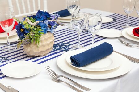 Table with beautiful setting in restaurant.の写真素材