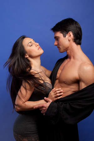 The passionate couple pose together for the photo.
