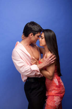 The sexy couple share an embrace together.の写真素材