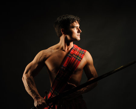 The handsome highlander poses for the photo.の写真素材