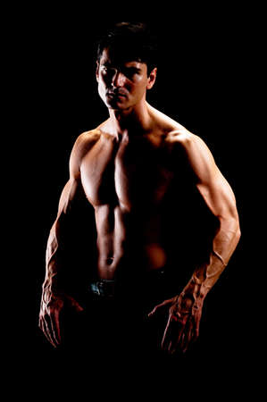 The hot guy poses for the photo.