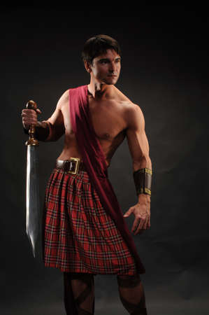 The handsome highlander poses for the photo.の写真素材