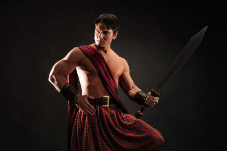 The handsome highlander poses for the photo.の写真素材