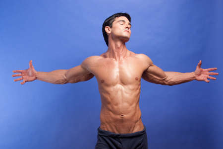 The sexy man poses for the photo.