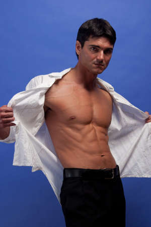 The sexy man poses for the photo.の写真素材