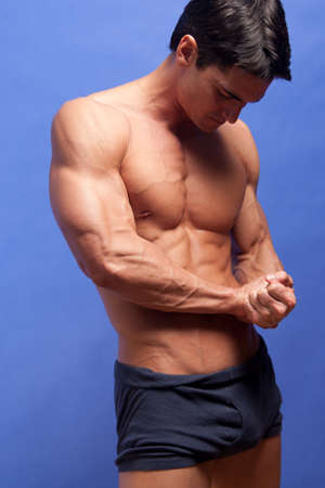 The sexy man shows off his muscles.の写真素材