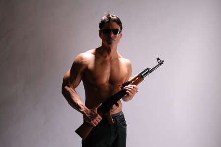 The sexy sniper poses for the photo.の写真素材