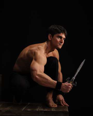 The sexy man poses for the photo.の写真素材