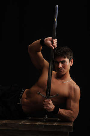 The sexy man poses for the photo.の写真素材