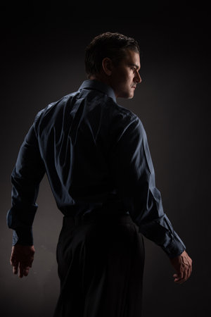 The sexy man poses for the photo.の写真素材