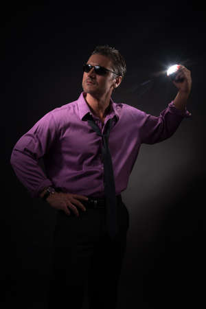 The sexy man poses for the photo.の写真素材