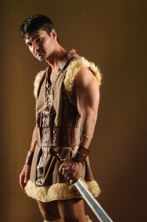 Portrait of a young man in the image of an ancient warriorの写真素材