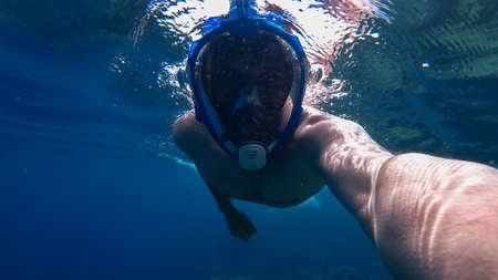 man snorkeling in the seaの写真素材