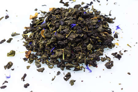 green tea leaves on a white background close up