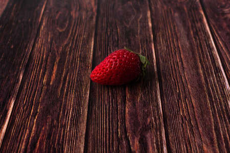 Fresh strawberries on a wooden table close-upの写真素材