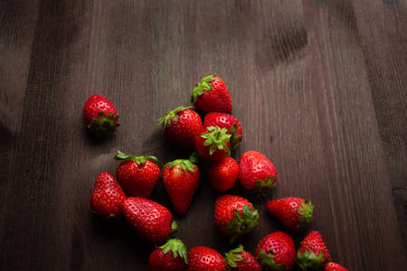 strawberries on a dark wooden backgroundの写真素材