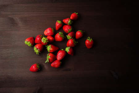 strawberries on a dark wooden backgroundの写真素材