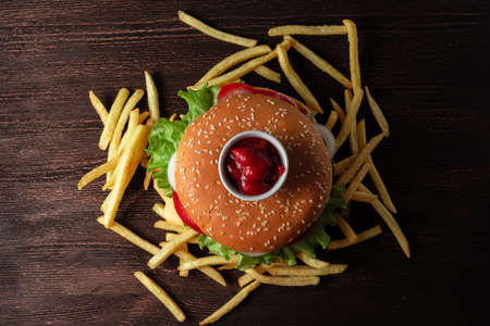 hamburger French fries on a wooden table