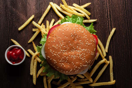 hamburger French fries on a wooden tableの写真素材