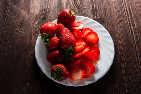 a bunch of strawberries on a plate