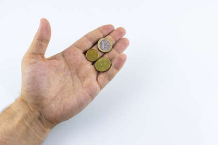 hand on a white background holding coins