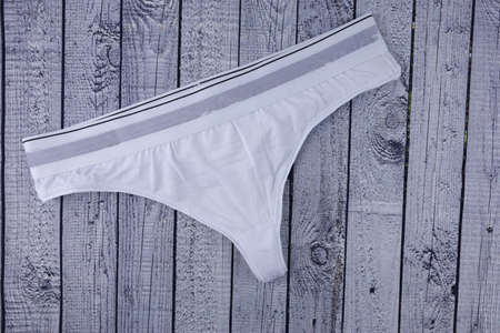 women's sports panties underwear on a wooden background