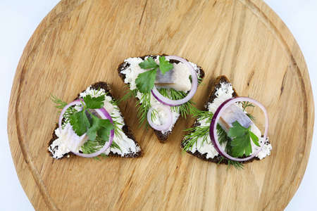 sandwiches with herring and cheese and onion