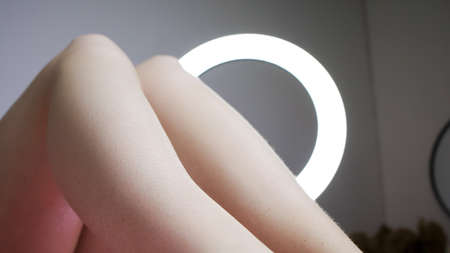 close-up of the legs of the model who is lying on the procedure of sugar hair removal