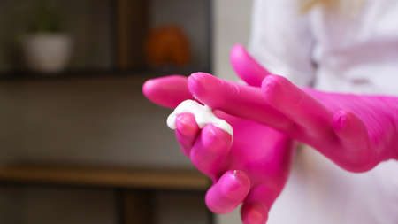 the master of sugar hair removal and removal of unwanted hair with wax stands in front of the client...