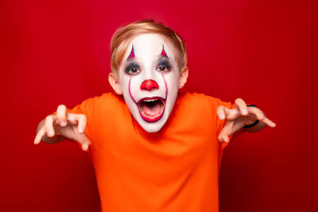 child with make-up before halloween scares.の写真素材