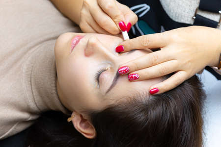 cotton swabs remove excess pigment from the eyelashes and
